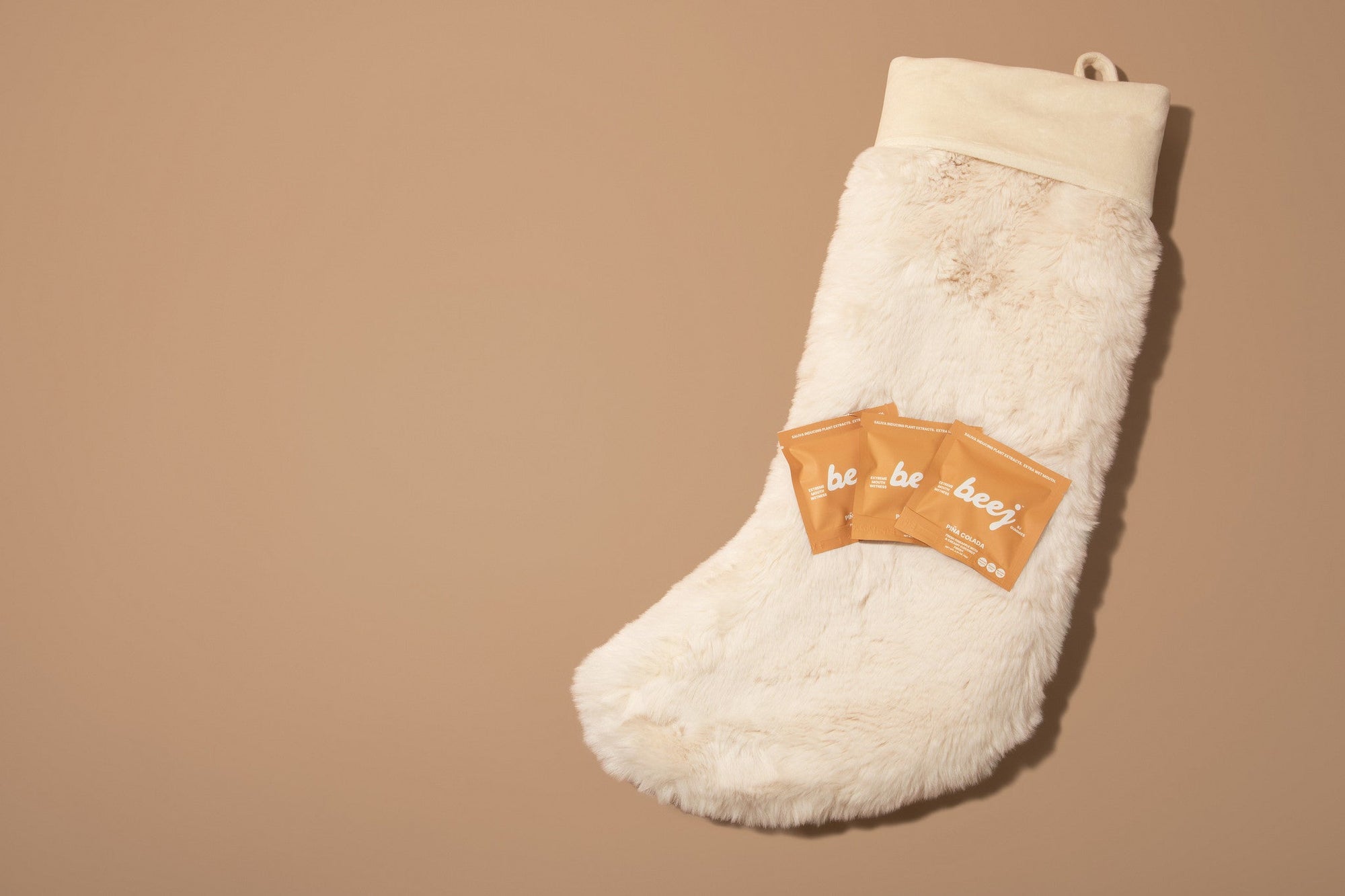 BJ gummies laying on a stocking - perfect stockingstuffers are perfect holiday gift for him