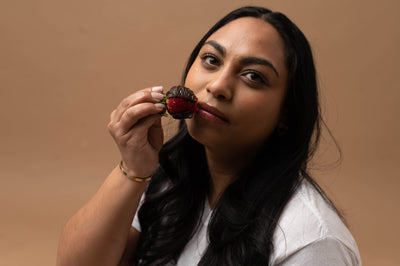 woman holding chocolate strawberries for beej oral sex treats