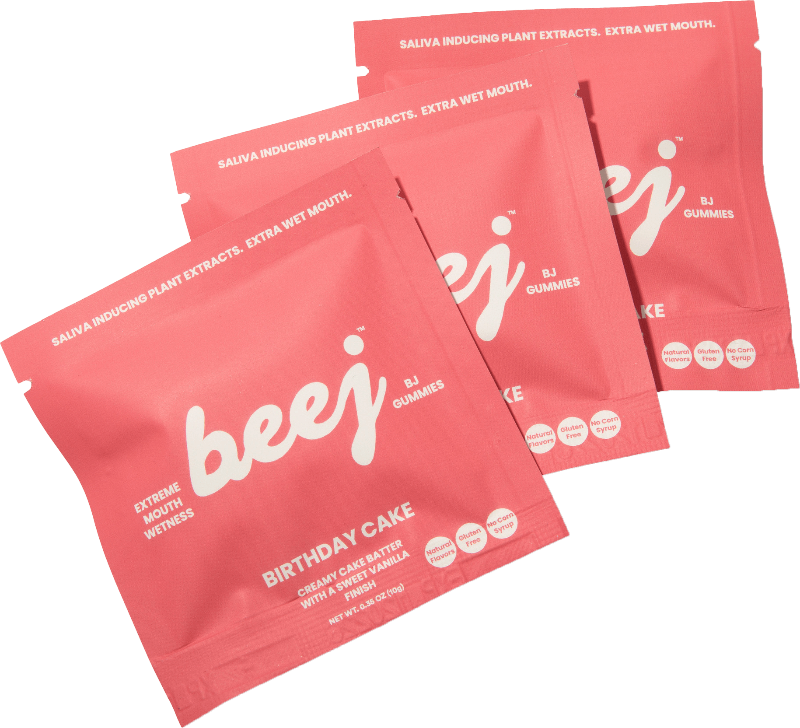 pink packets of 'beej' Birthday Cake flavor bj gummies on a white background
