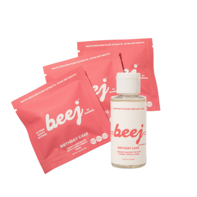 Beej edible massage oil and oral sex candy products including sachets and a bottle on a white background