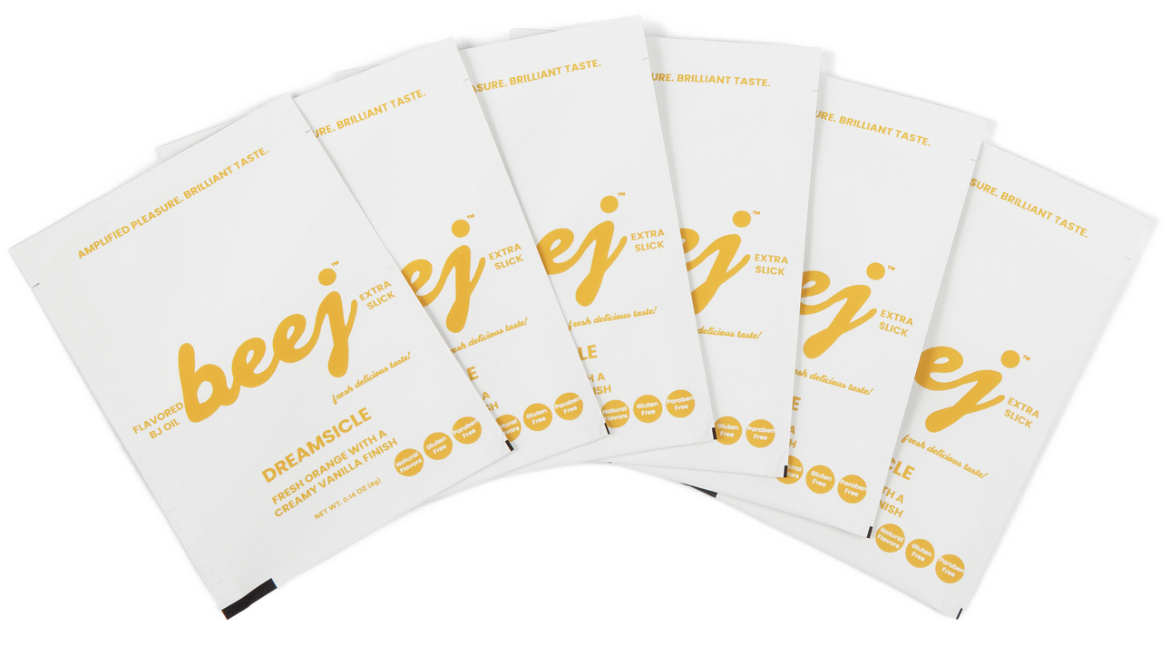 Set of white  edible oil massage packages with 'beej' branding on a white background