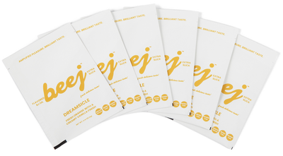 Set of white  edible oil massage packages with 'beej' branding on a white background